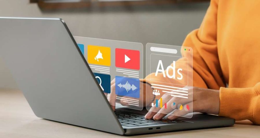 business owner creating and paying for facebook ads to promote services to a wider audience if they do not have a lot of followers